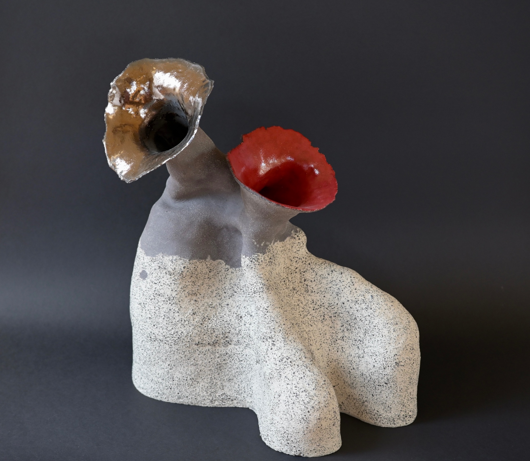 The Other Within, ceramic sculpture with one red opening and one reflective metallic opening